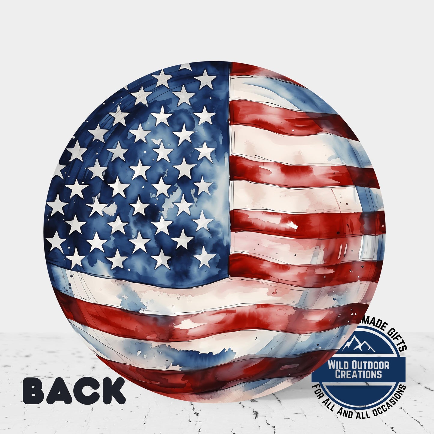 an American flag painted on a round, watercolor-like surface.