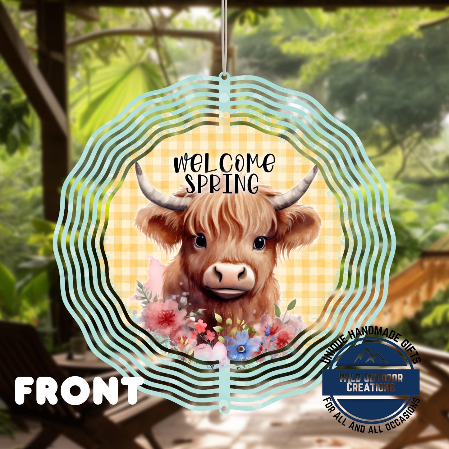 Highland Cow Spinner - Double Sided Outdoor Garden Decor with UV Protected Finish - shown spinning in outdoor garden setting
