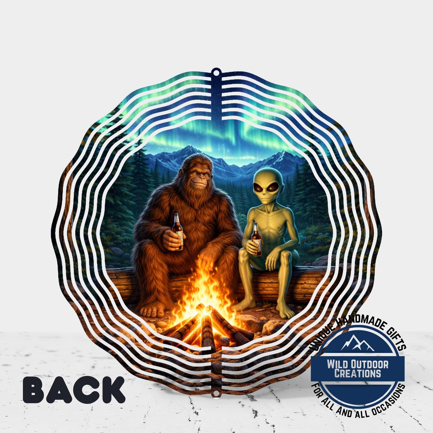 A collage of two images depicting a large brown creature and a smaller alien sitting by a campfire in a forest setting, with a starry night sky in the background.