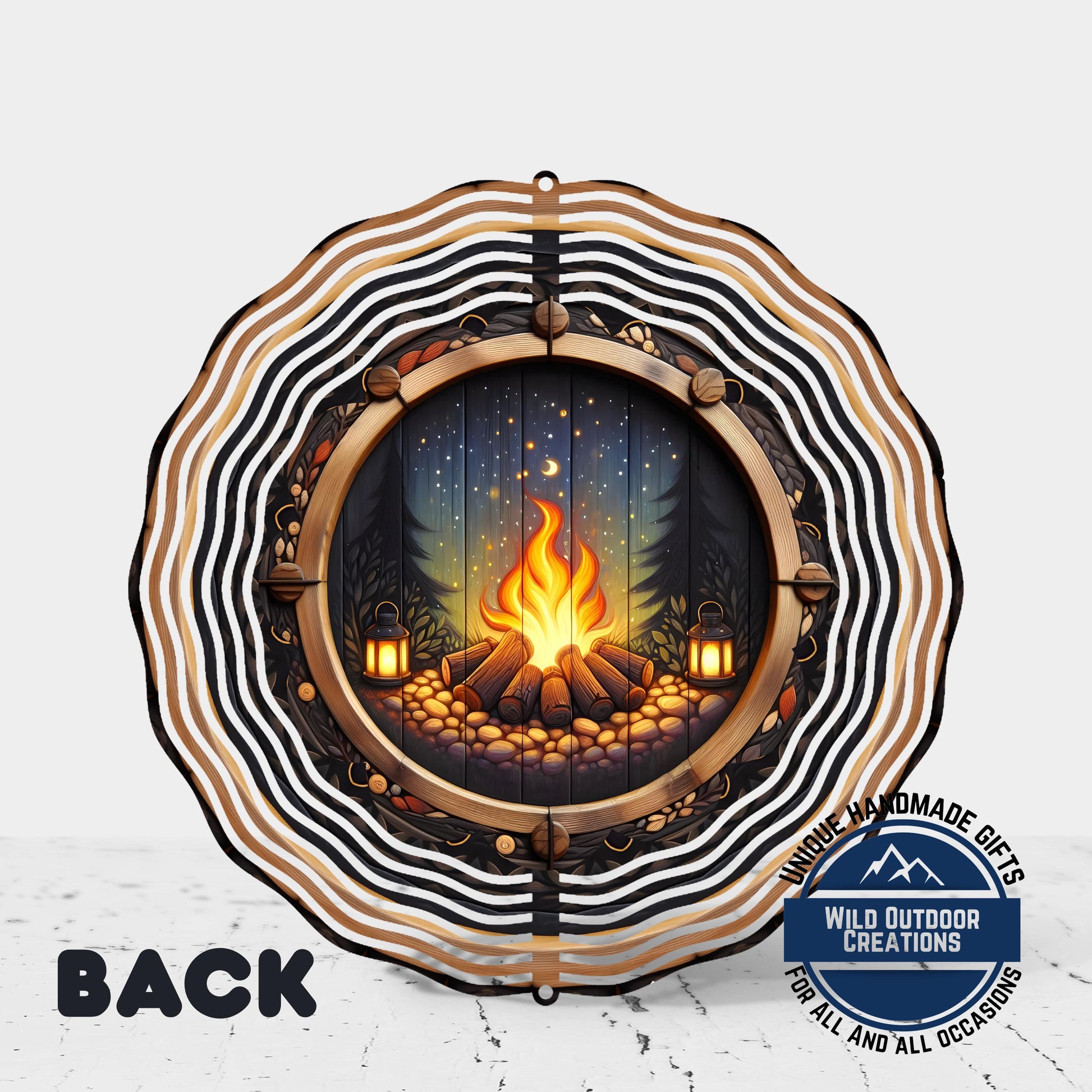 a decorative metal wind chime with a fire pit design.
