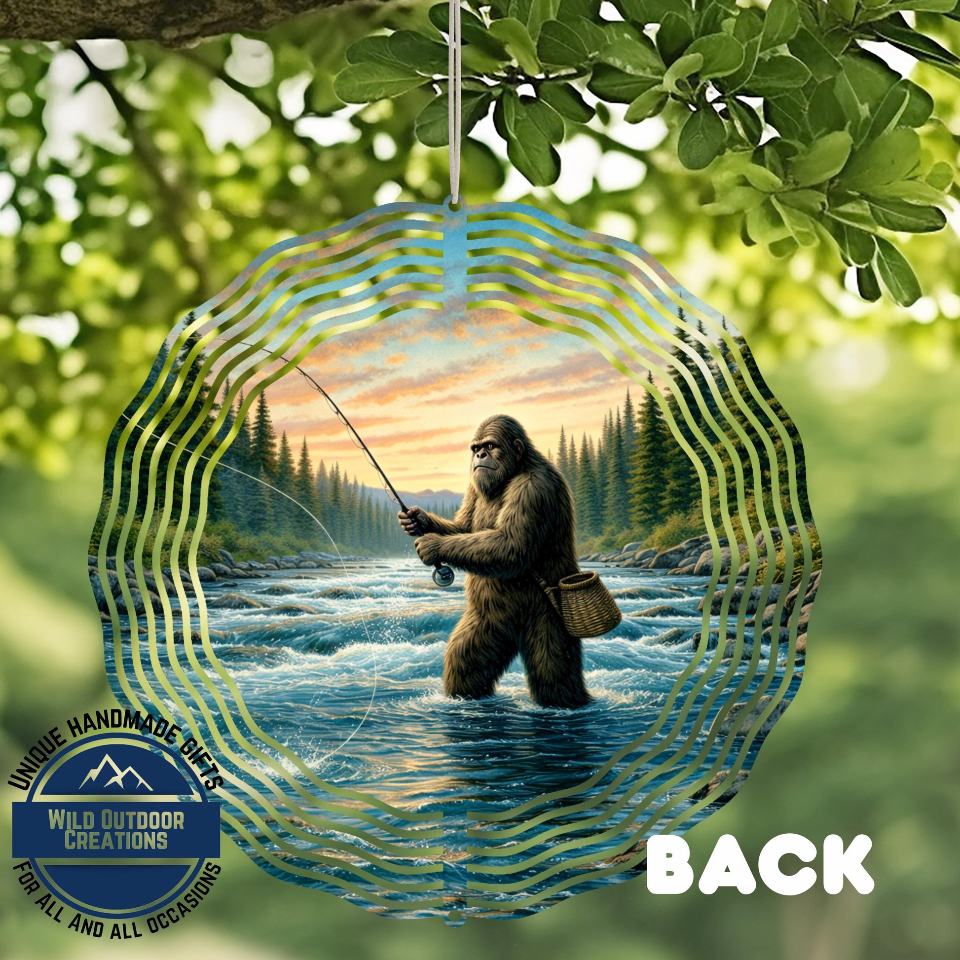 A large, circular ornament featuring a fishing scene with a giant, furry creature holding a fishing rod and standing in a river surrounded by trees.