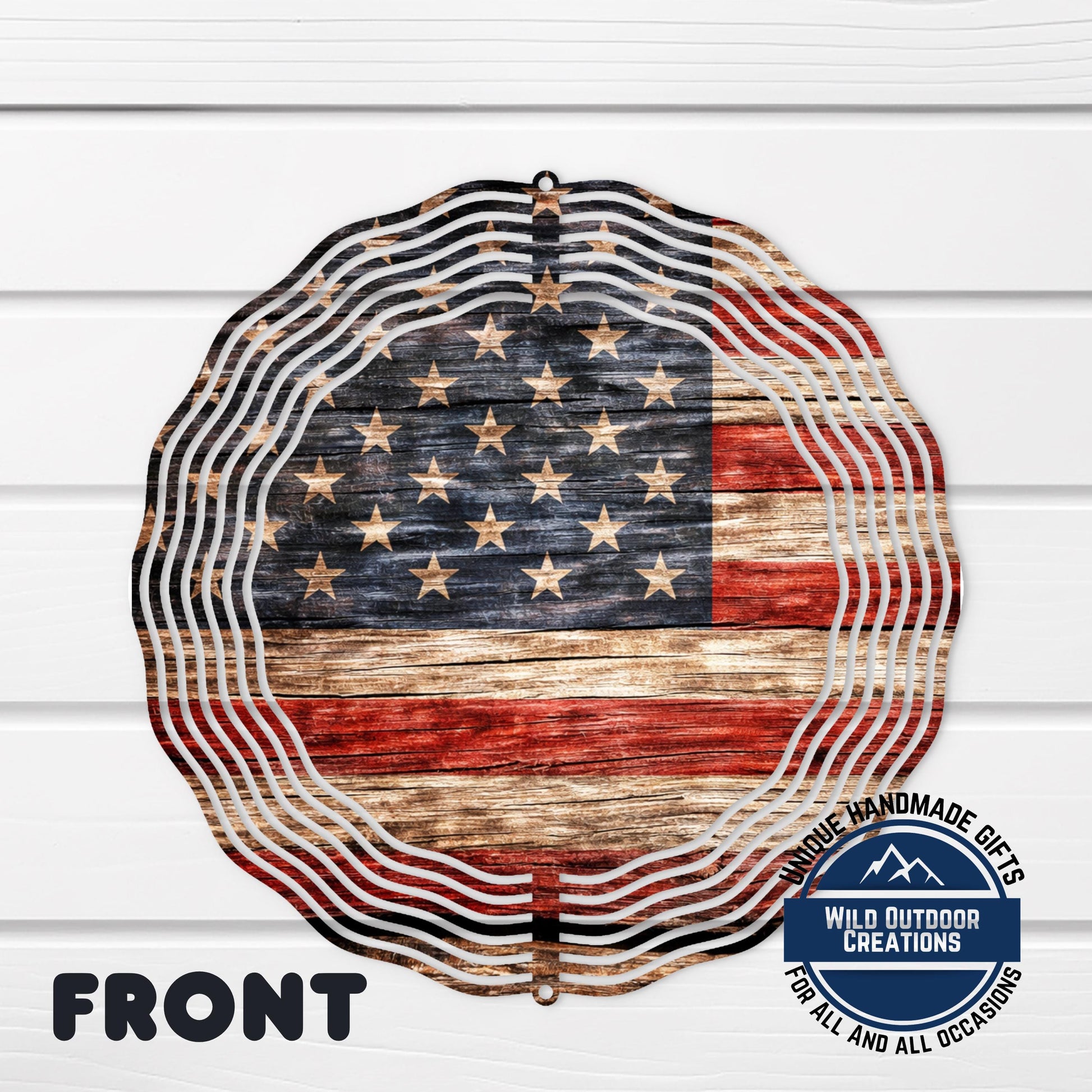 a large American flag-themed wind chime with a distressed wooden texture and a circular shape.