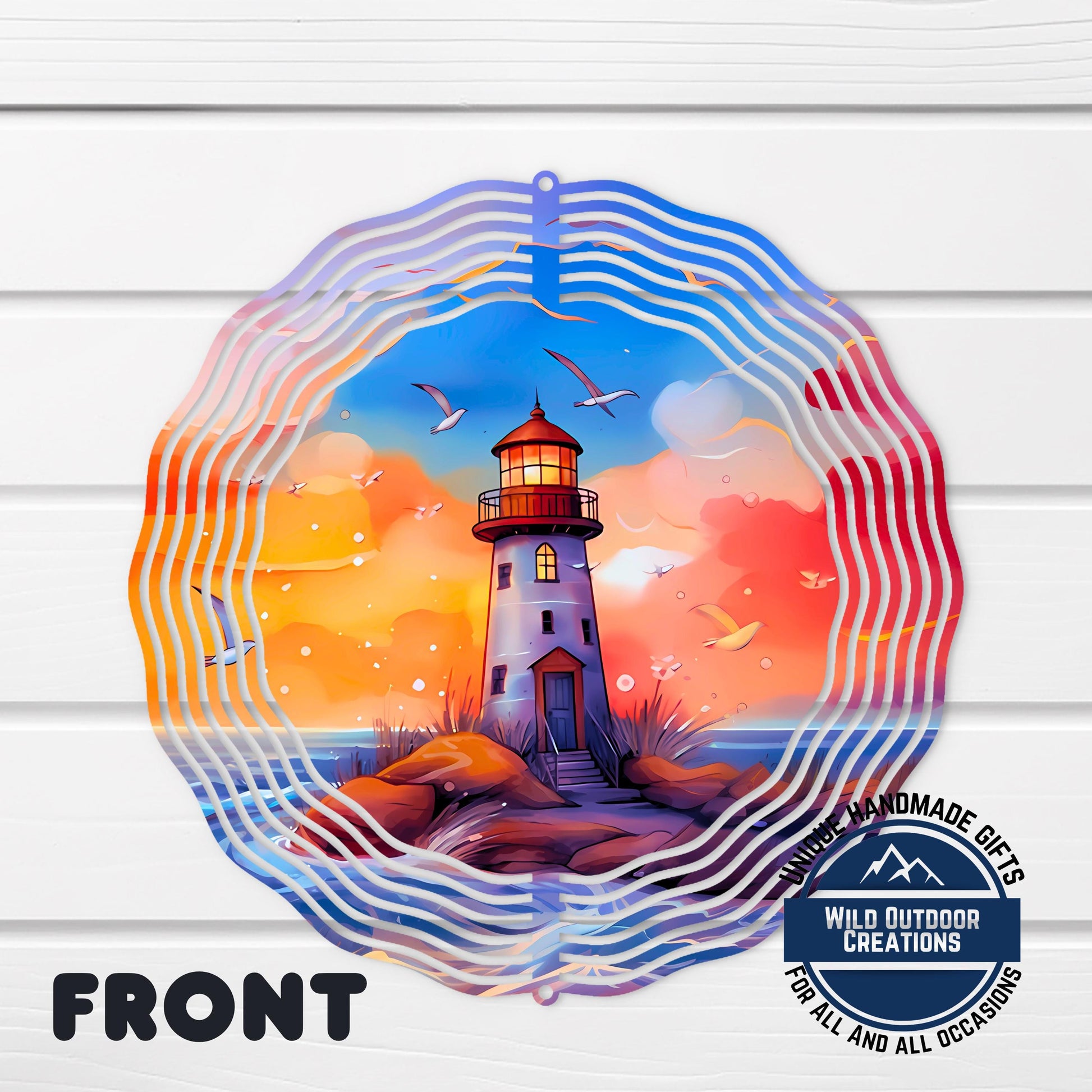 Lighthouse Wind Spinner – 10 Inch Double Sided Aluminum Coastal Yard Art - shown spinning in outdoor garden setting