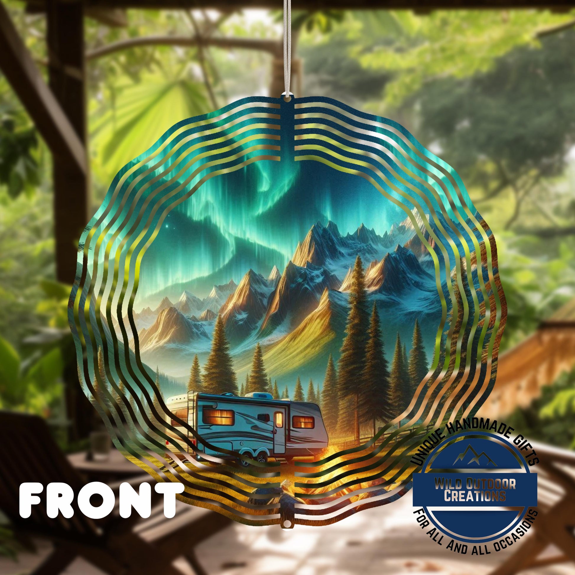 Northern Lights Wind Spinner - Double Sided Camping Spinner with Mountain Scene - shown spinning in outdoor garden setting